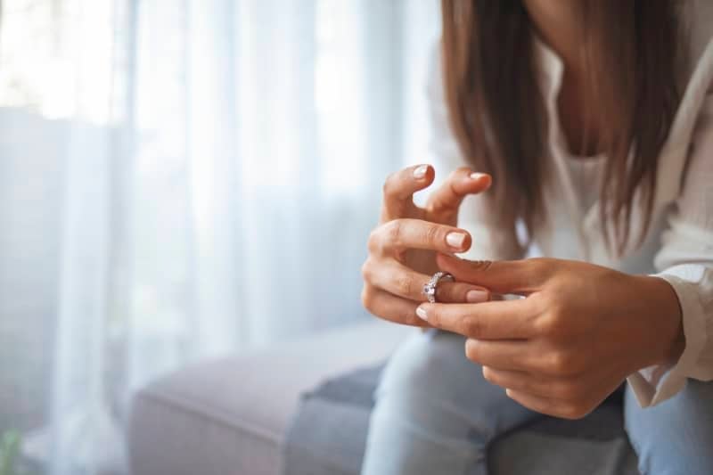 Woman Removing Wedding Ring